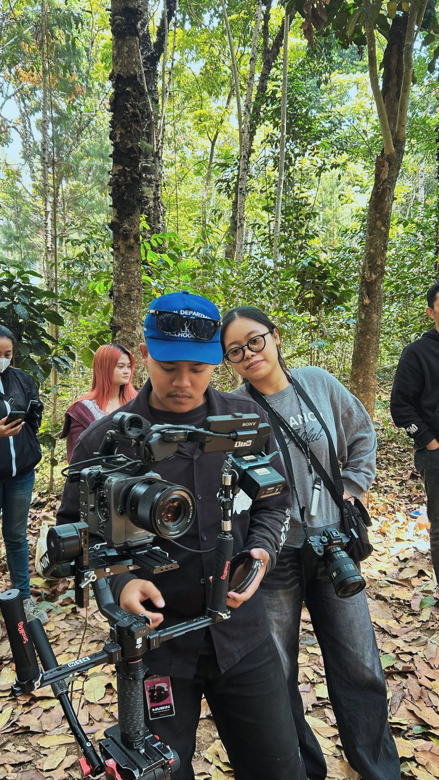 Crew filming in a forest