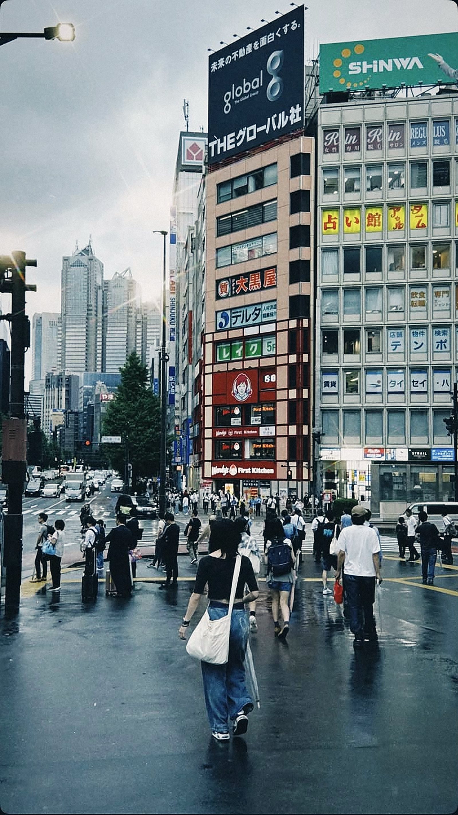 Rainy Shinjuku street crossing in Tokyo
