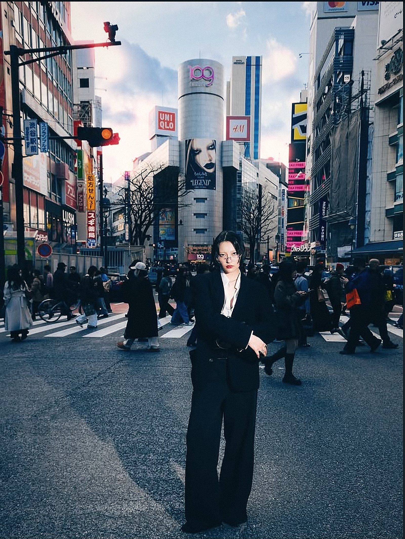 Model in a black suit at the Shibuya crossing in Tokyo